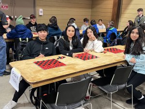 Kids in front of checkers board