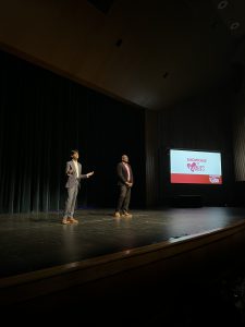 Hosts speaking on stage