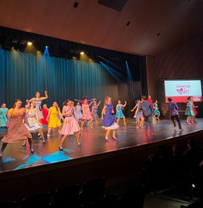 Students performing on stage