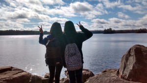 Two students by a lake