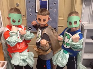3 children dressed in Earth Warrior costumes