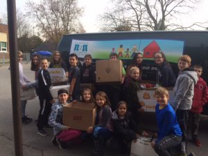 Kids sitting and holding boxes