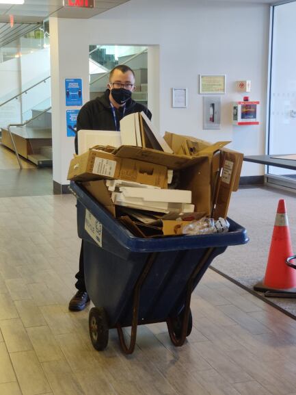 Student taking out trash