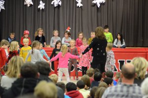 Students and teacher on stage