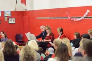 3 teachers on a piano