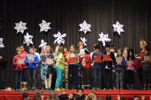 Students on stage singing