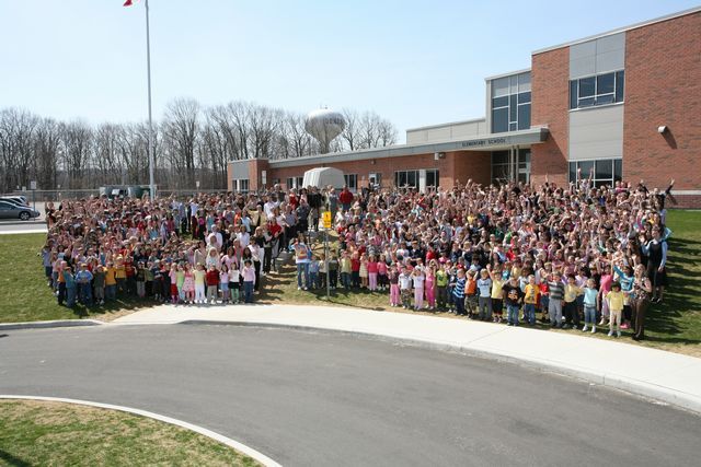 Kids outside of school for group picture