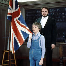 student and teacher with flag