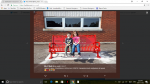 Kids sitting on a buddy bench