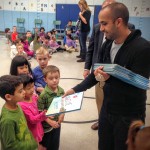 Pasricha hands out copies of his new book Awesome is Everywhere.