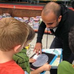 Pasricha hands out copies of his new book Awesome is Everywhere.