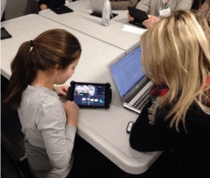 Students looking at an Ipad