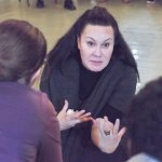 Mentors help students with spoken word at Experiential Learning Day in the Arts.