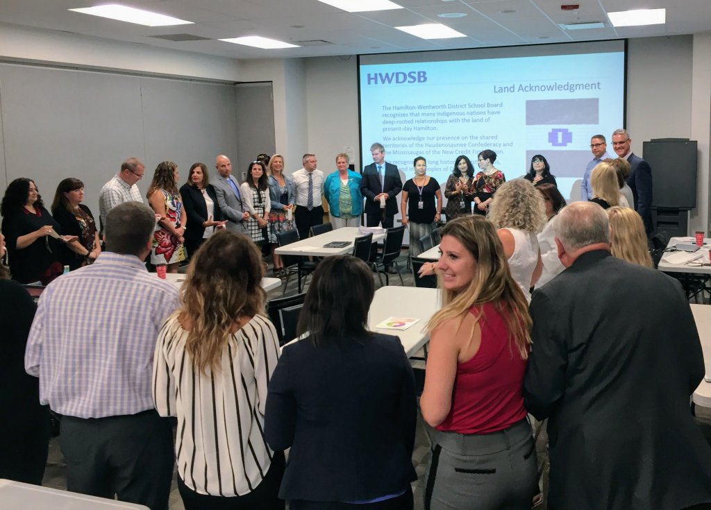 principals standing in circle