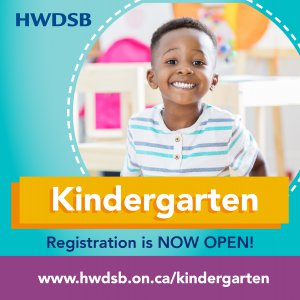 Child smiling in classroom. Text says: "Kindergarten Registration is Now Open"