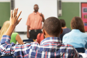 person in class with hand up