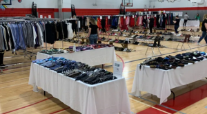 prom project setup with dresses and suits in the gym