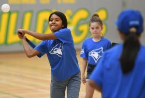 bellmore student swinging baseball bat as part of jays care program