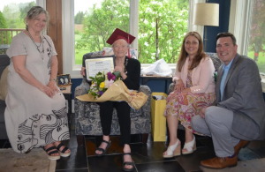 isabel receiving her diploma for 100th birthday