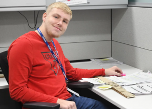Project SEARCH student working at desk.