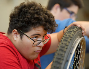 Student working on bike for secondary school course
