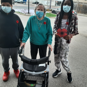 students with retirement resident on remembrance day