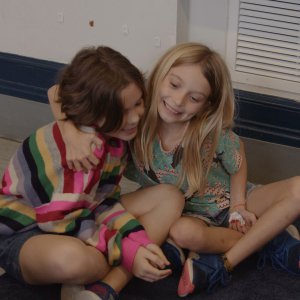 students embracing each other during reimagining wellness lesson