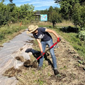 focus on youth student at community garden