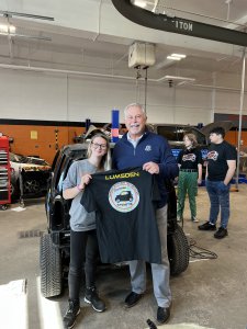 Mr. Lumsden gifted with a shirt from Transportation student