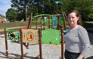 G.L. Armstrong School council member Jolene Andrews in front of the new playground equipment recently installed behind the Concession Street elementary school