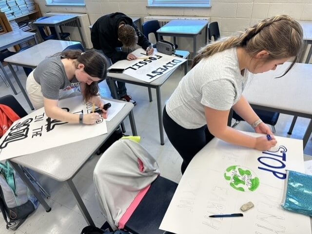 Students creating posters