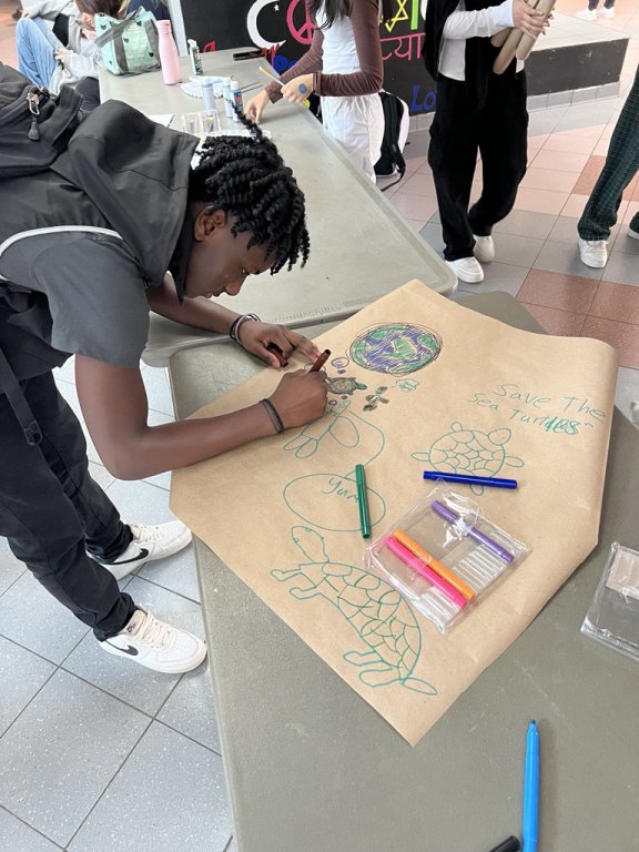 Saltfleet student creating a poster