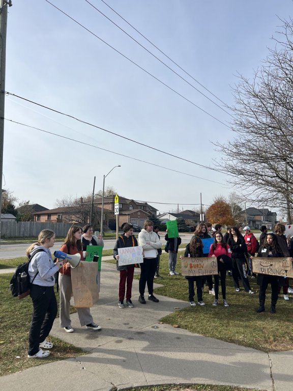 Saltfleet students standing with posters