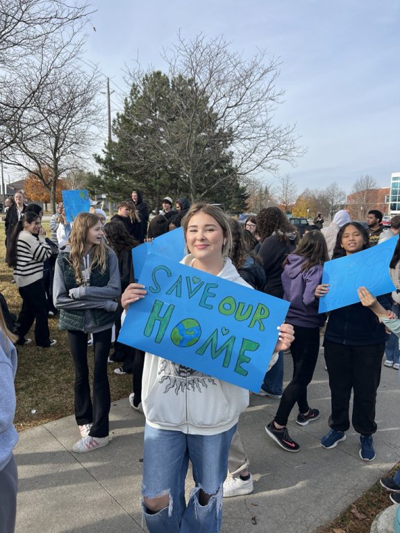 Saltfleet student holding their poster