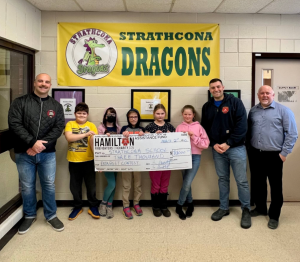 Photo of Strathcona students with Hamilton Professional Fire Fighters Association (HPFFA) – Local 288 holding a check