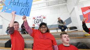 student fans cheering at hockey game