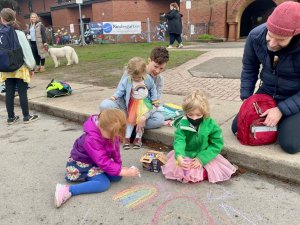 Strathcona students drawing on sidewalk