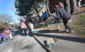 cover photo from school streets spectator article with community members playing in street