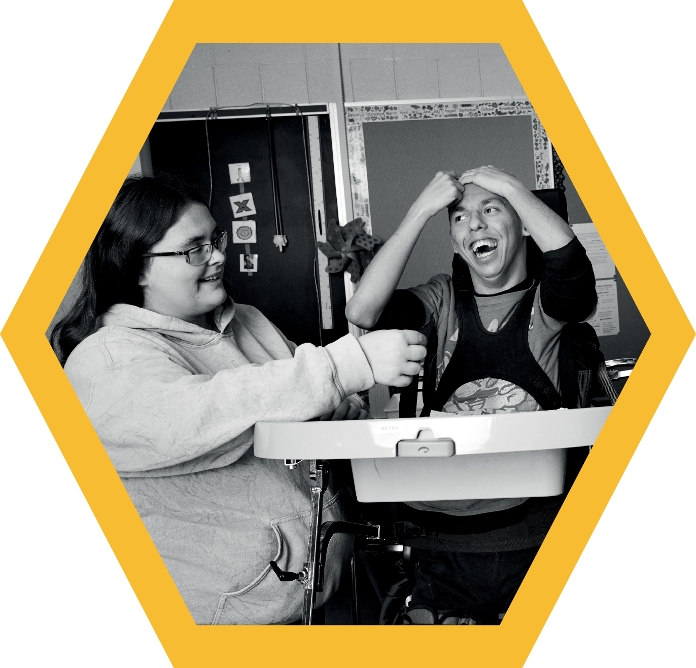 Photo of two students laughing. 